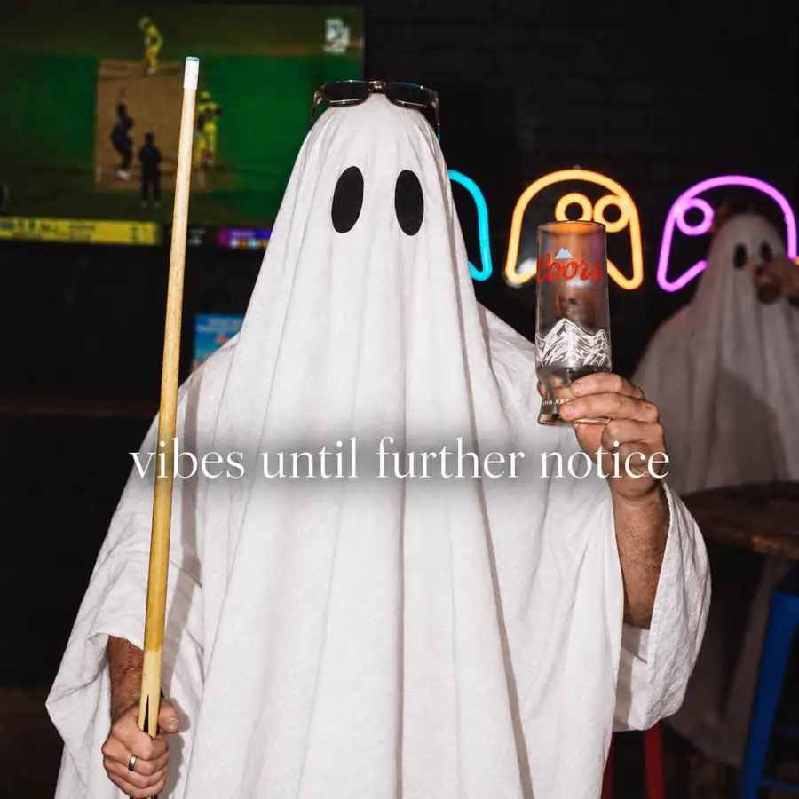 Neon ghost lights and a pool cue in the games room