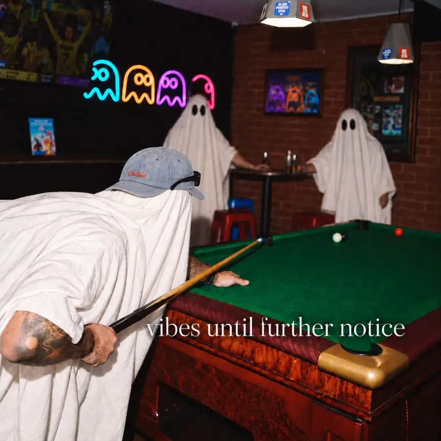 Pool table and Pac-Man neon in the Alibi games room