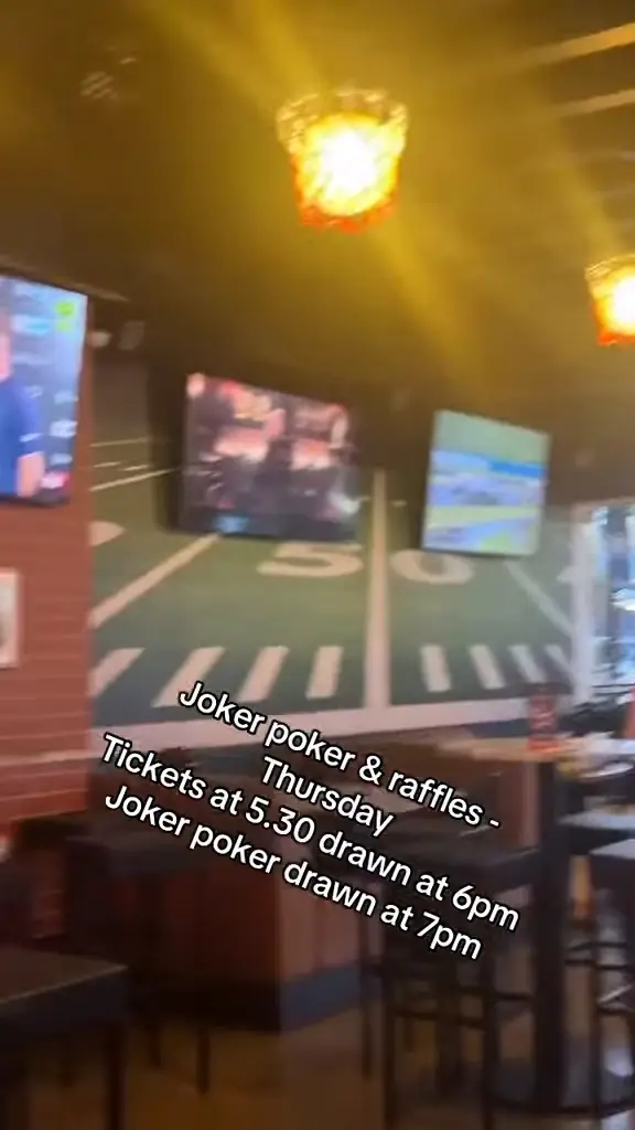 Big screens and the field wall inside The Alibi